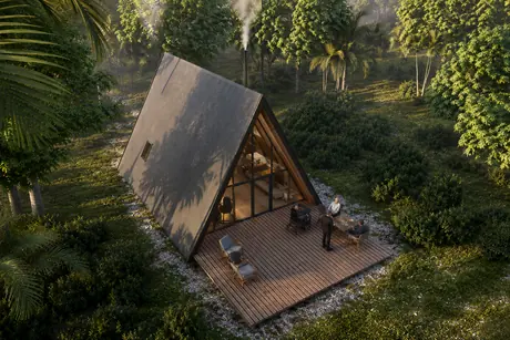 Aerial view of the cabin in its clearing
