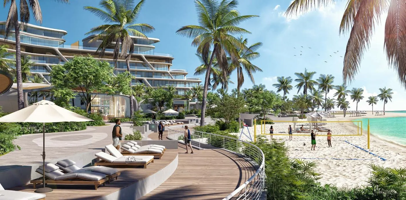 The timber beach deck running below the building toward the sand