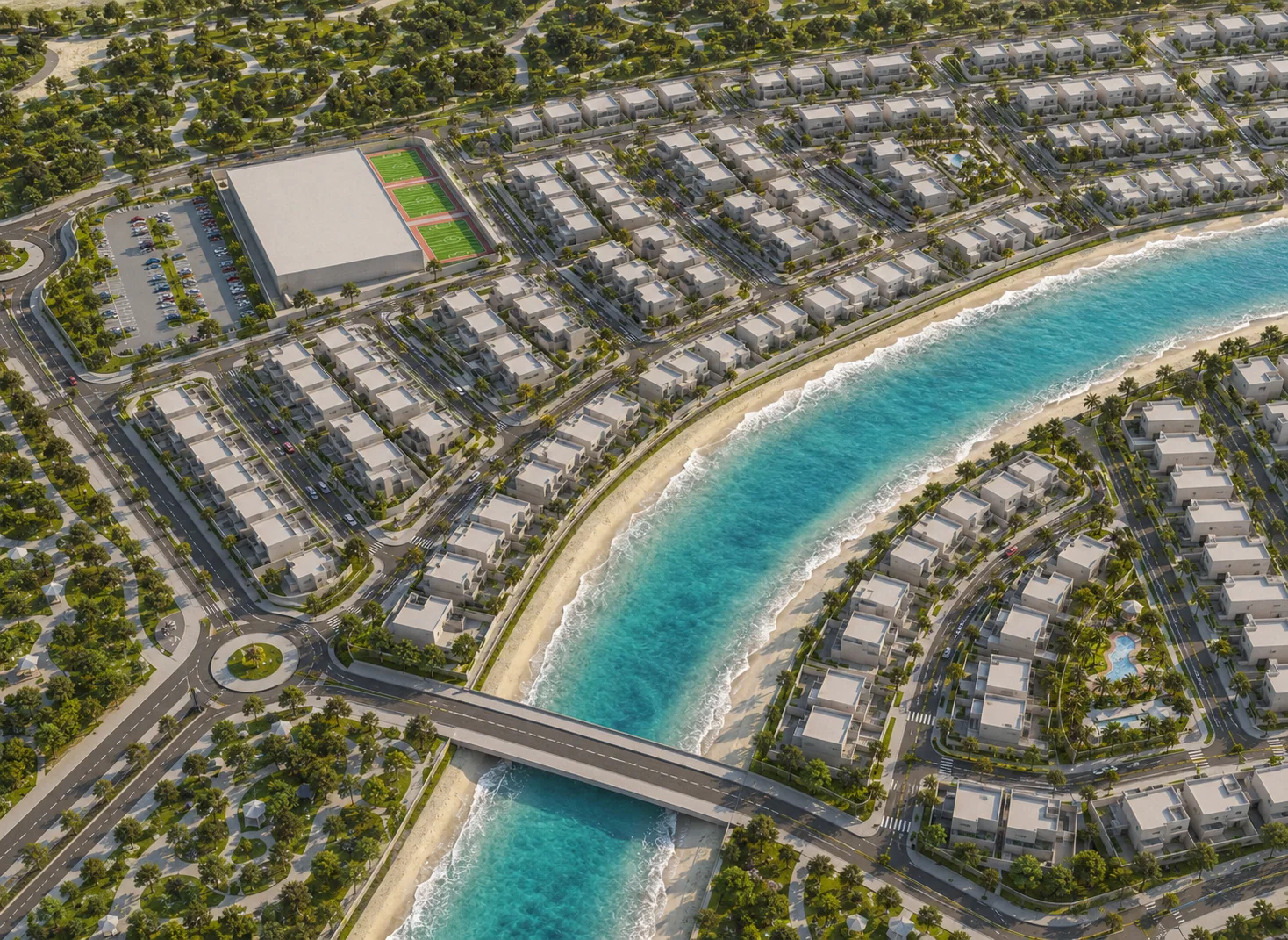 Aerial view of Ohana Al Jurf Phase 05 A, the saltwater channel curving through the residential blocks